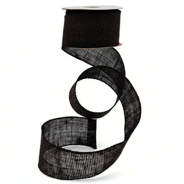 Black mesh ribbon on a white spool against a gray background