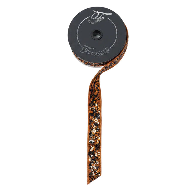 A roll of Farrisilk wired ribbon with a dark gray spool, shown on a light wood background. The ribbon features a metallic bronze glitter border with small black and orange sequins.