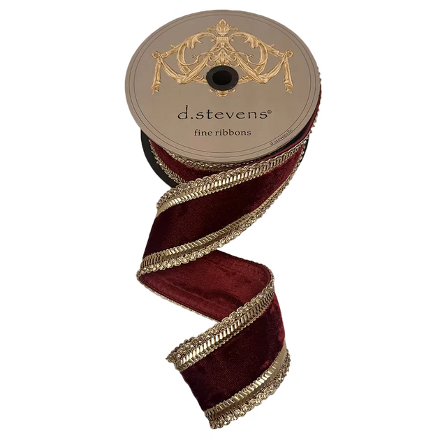 Spool of burgundy ribbon with gold edge and 'd.stevens' label on a light gray background