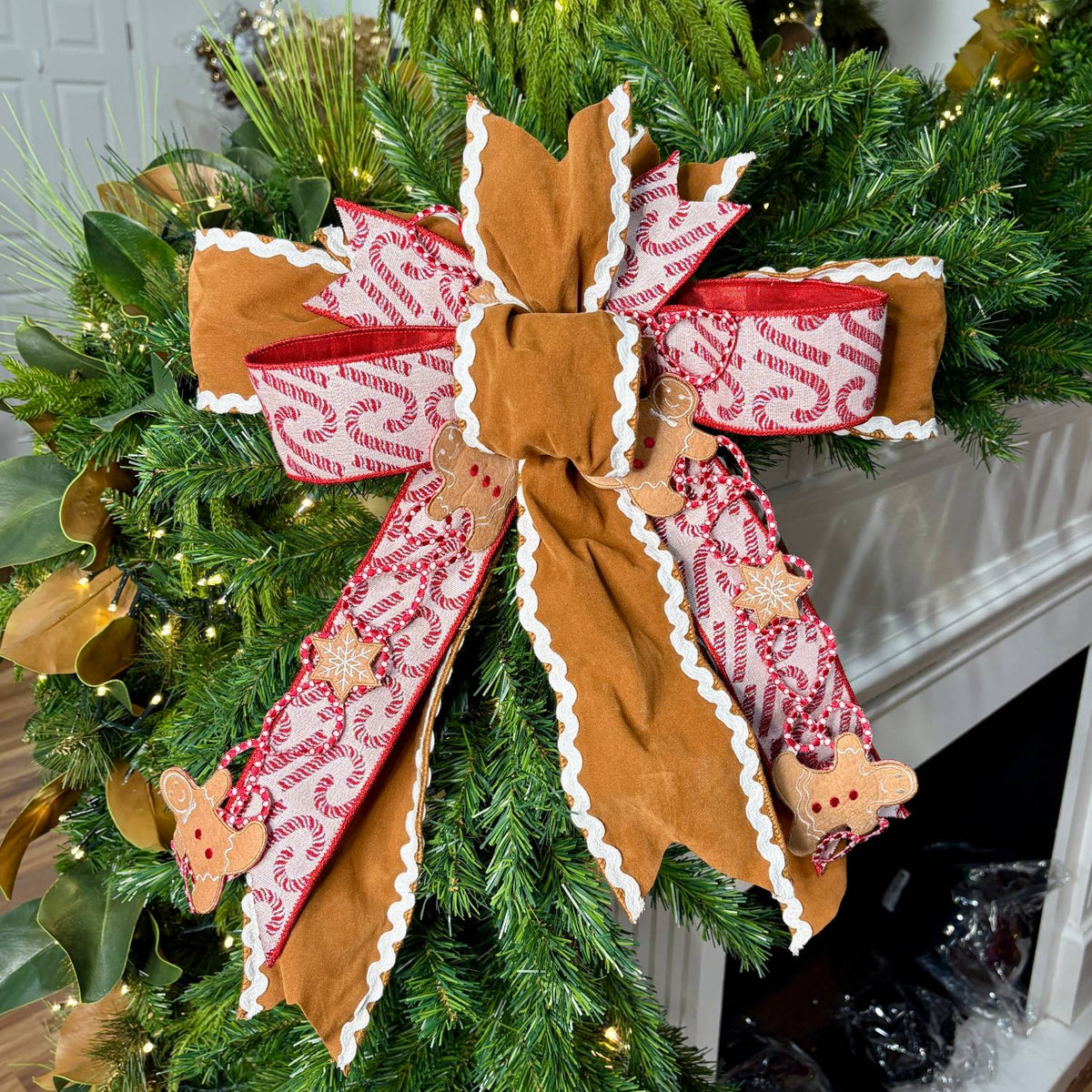 16 inch Gingerbread Bakery hand-tied Christmas designer bow with gingerbread suede, candy cane ribbon and gingerbread men, on a garland