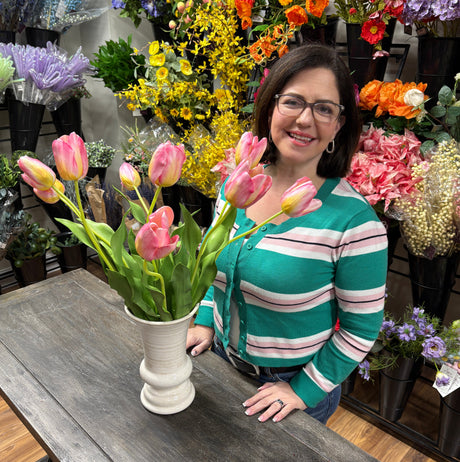 Woman arranging flowers in a floral shop
