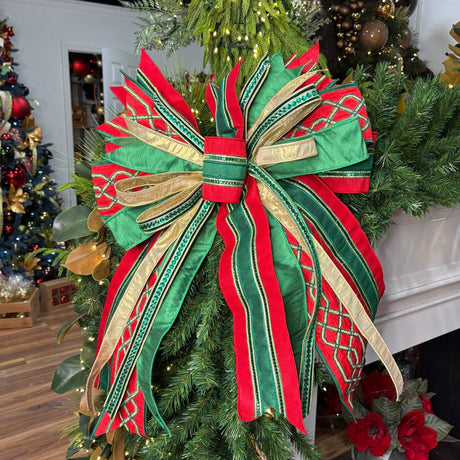 20 inch Regal Christmas Splendor hand-tied designer bow with red, emerald green and gold jeweled ribbon, on a garland
