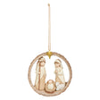 Decorative hanging ornament with figures of Mary and Joseph, baby Jesus, and a sheep in a circular wreath on a white background.