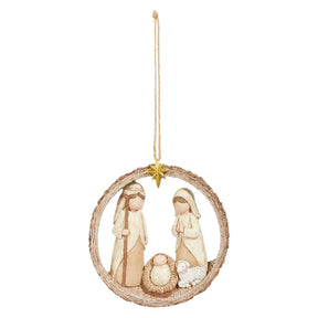 Decorative hanging ornament with figures of Mary and Joseph, baby Jesus, and a sheep in a circular wreath on a white background.