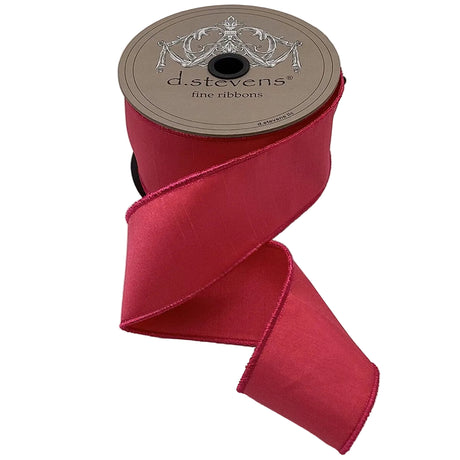 Spool of red ribbon with 'd.stevens' label on a light gray background