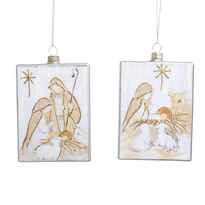 Two rectangular glass Christmas ornaments depicting a nativity scene with Mary, Joseph, and baby Jesus.