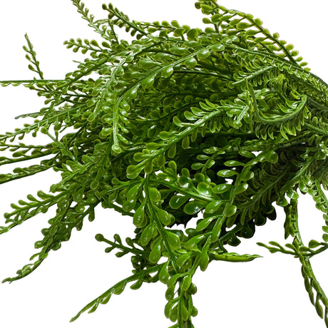 closeup of Green artificial bead grass on a white background