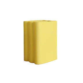 Yellow rectangular vase on a beige background