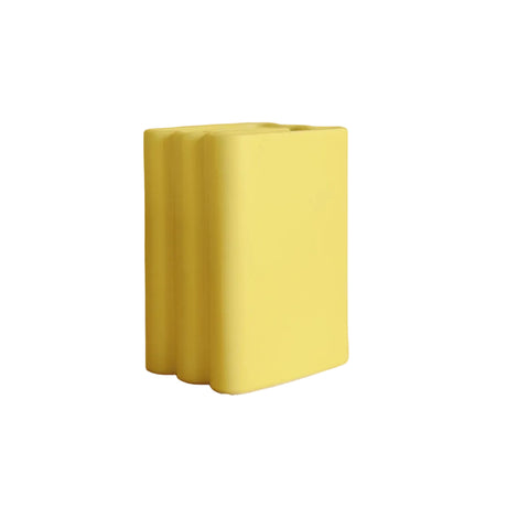 Yellow rectangular vase on a beige background