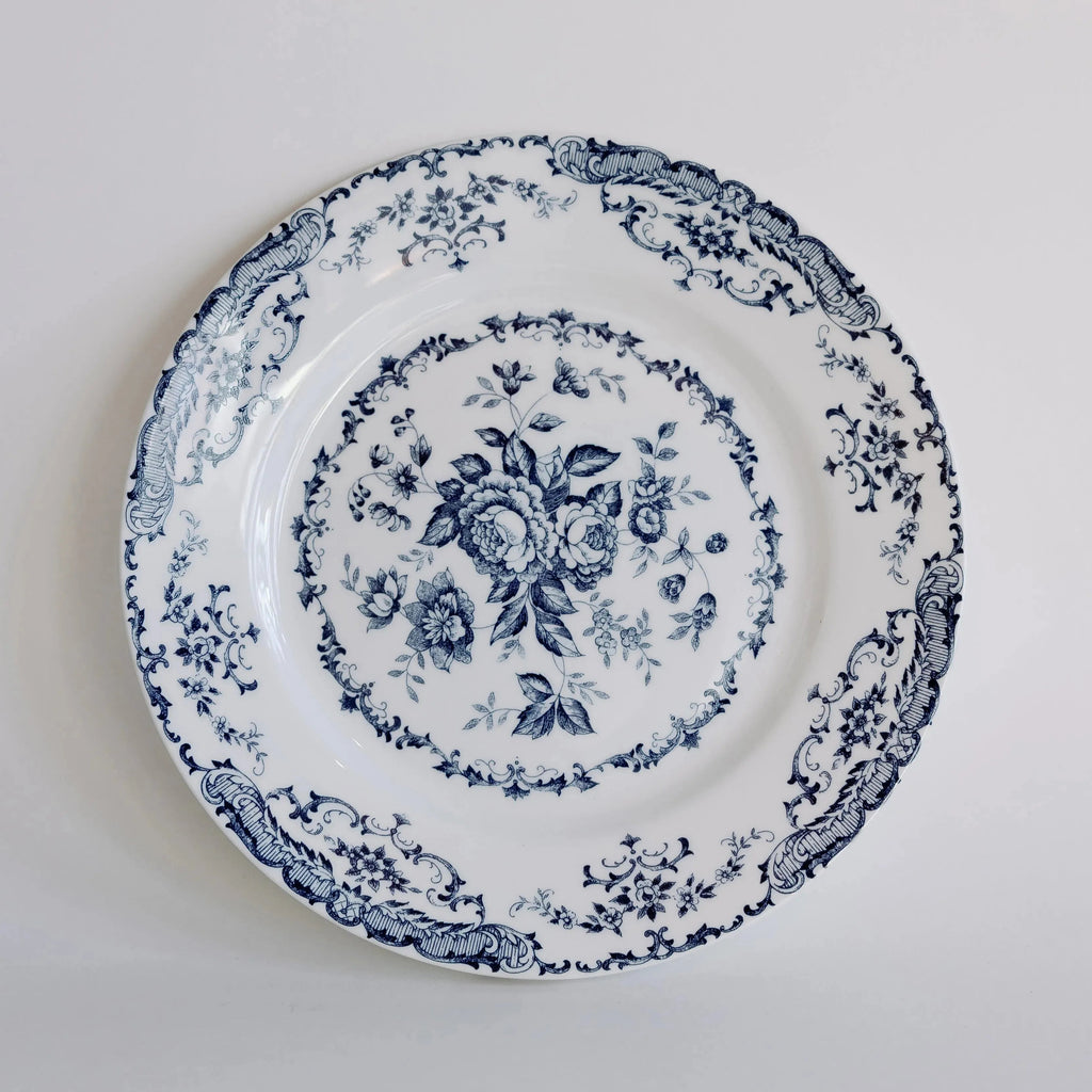 Decorative plate with blue floral pattern on a white background