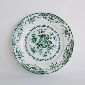 Decorative plate with green floral pattern on a white background