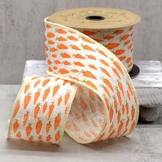 Roll of ribbon with carrot pattern on a neutral background