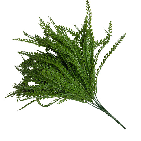 Green leafy branch on a grid background