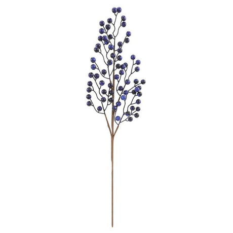Artificial plant branch with blue berries on a white background
