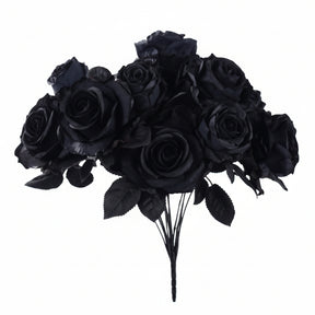 A bouquet of artificial black roses with dark green leaves and black stems, isolated on a white background.