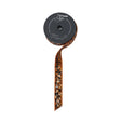 A roll of Farrisilk wired ribbon with a dark gray spool, shown on a light wood background. The ribbon features a metallic bronze glitter border with small black and orange sequins.