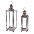 Two vintage-style metal lanterns with clear glass panels and top loop handles, shown on a plain white background.