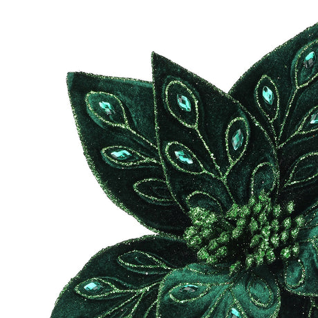 Decorative green flower with gem-like embellishments on a white background