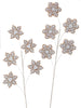 Decorative gingerbread snowflake branches on a white background
