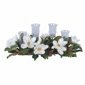 Decorative candle holder with white flowers and green leaves on a white background