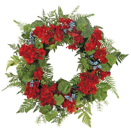 Decorative wreath with red flowers and green leaves on a white background