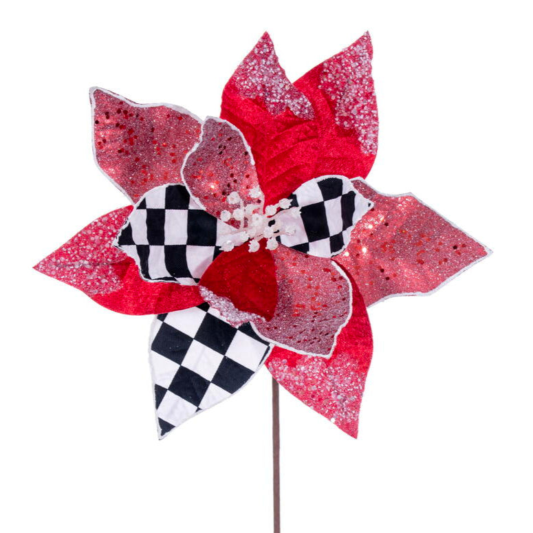 A artificial poinsettia stem with red, white, and black petals, glitter and sequin embellishments, on a brown paper-wrapped wired stem.