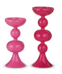Two pink candle holders on a white background