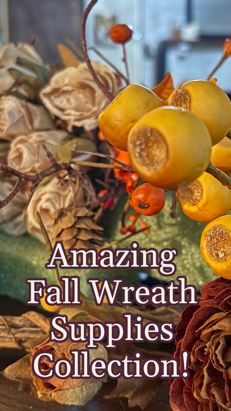 Collection of fall wreath supplies including dried flowers and berries on a wooden surface.