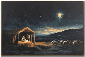 A framed religious painting depicting the Star of Bethlehem shining over a stable with Mary and Joseph, with sheep grazing in a dark night landscape.
