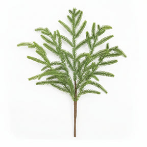 Artificial norfolk pine tree branch on a white background