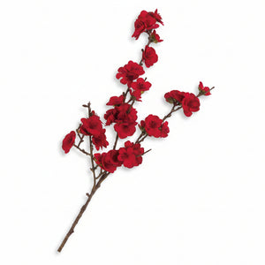 Artificial red velvet cherry blossom flower branch on a white background