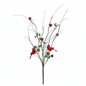 Artificial winter branch decoration with red birds, red berries, and green leaves on a white background.