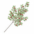 An artificial holly branch with green leaves and small red berries on a white background.