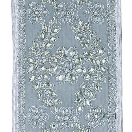 A close-up of silver fabric panel featuring intricate silver and white floral embroidery with sequins and beadwork, framed by a decorative border.