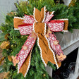 16 inch Gingerbread Bakery hand-tied Christmas designer bow with gingerbread suede, candy cane ribbon and gingerbread men, on a garland