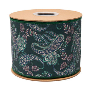 A spool of decorative ribbon with a dark green background and a detailed paisley pattern in teal, white, and pink, mounted on natural wood spools.