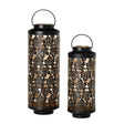 Two black lanterns with floral patterns on a white background