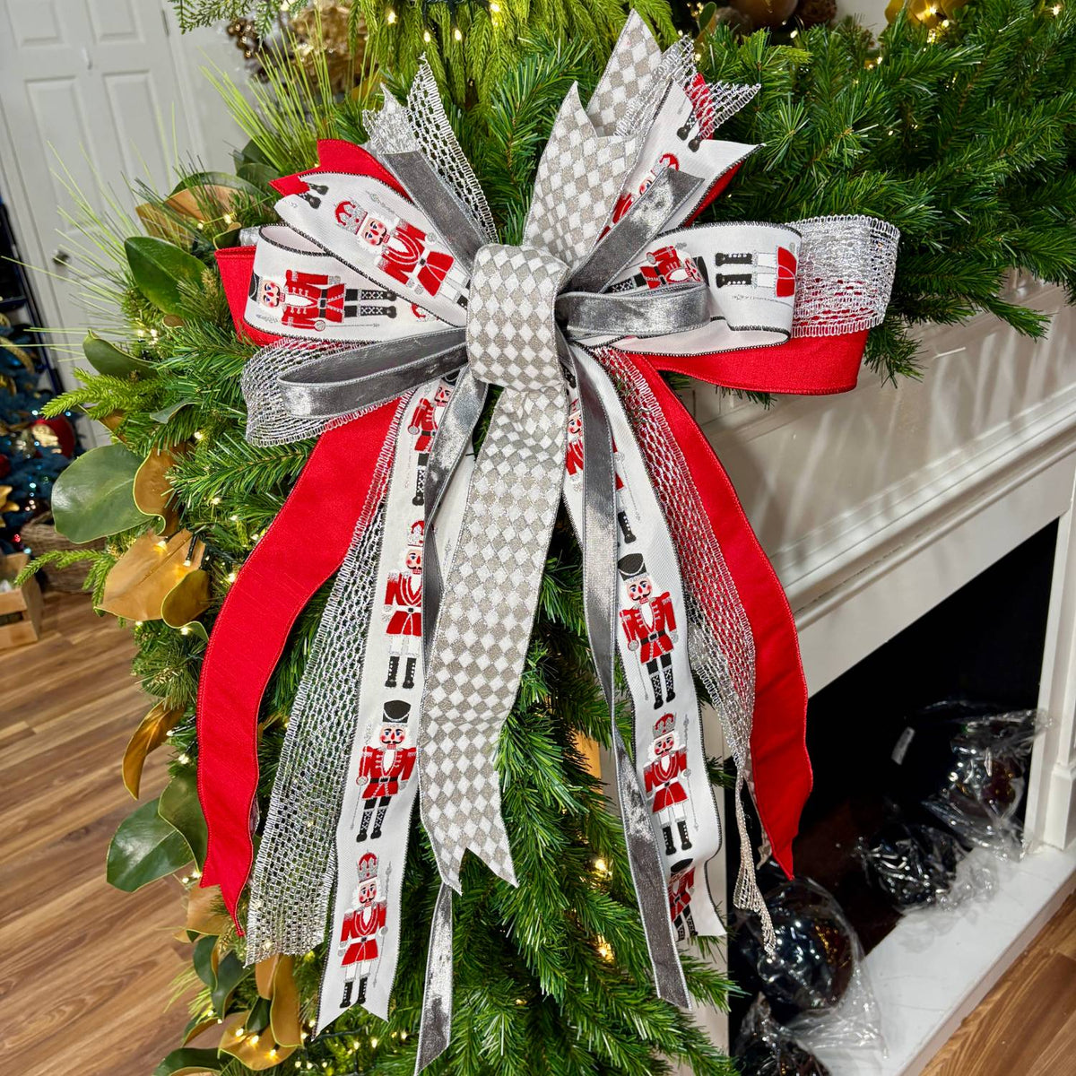 20 inch Silver Nutcracker hand-tied Christmas designer bow with nutcracker soldiers, red and silver ribbon, on a garland