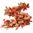 Decorative floral garland with red, orange, and green leaves on a white background